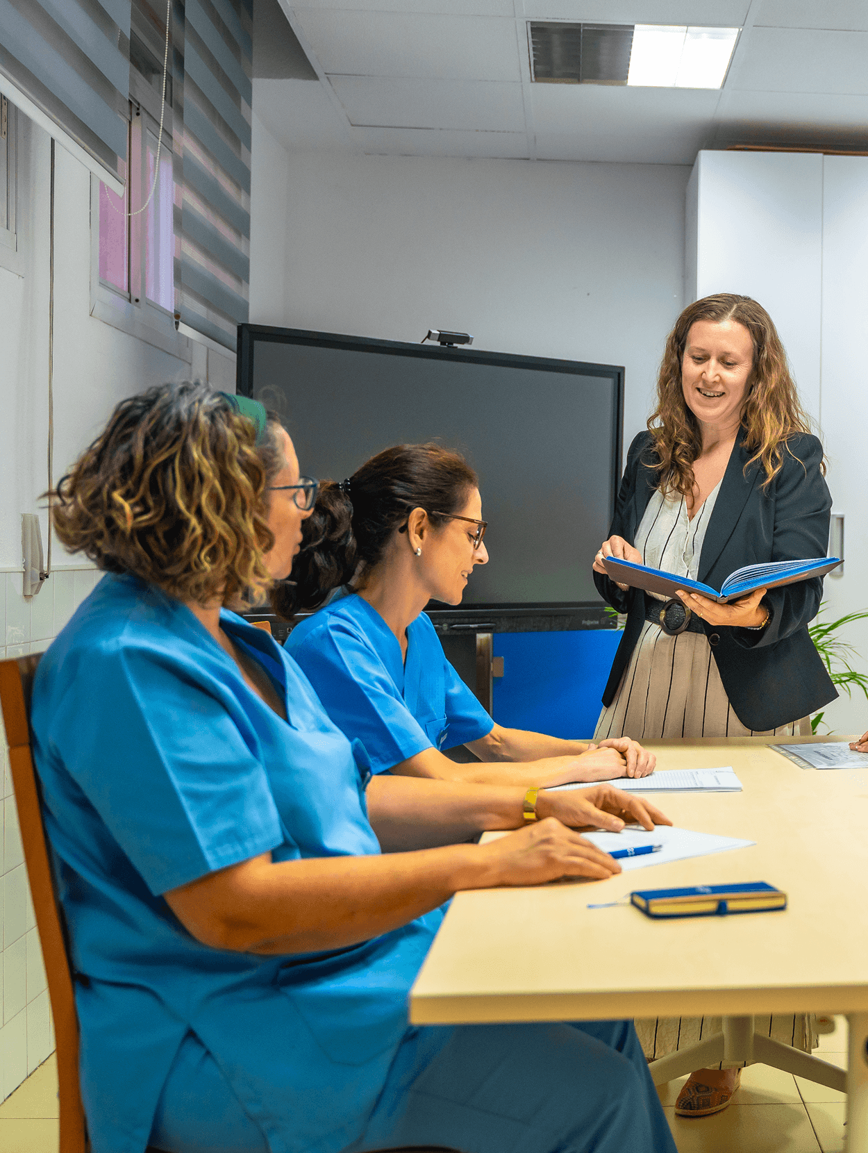 team-health-workers-sitting-meeting-room