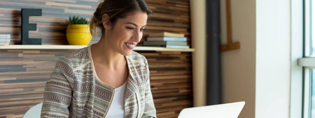 a care home worker taking an online health and social care course to stay compliant