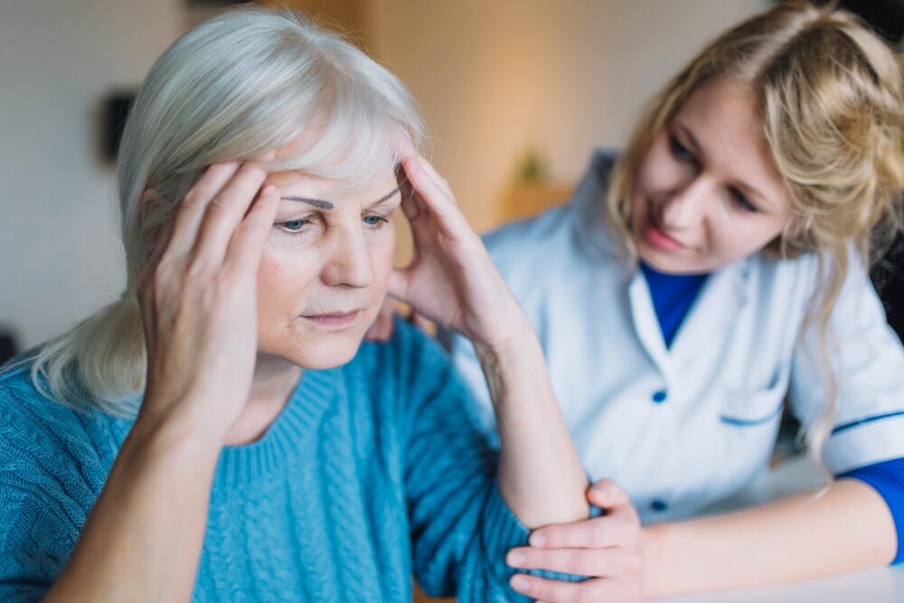 a care home worker assisting a resident with her specific mental health issues