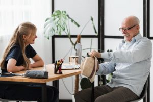 a care home manager speaking to a resident